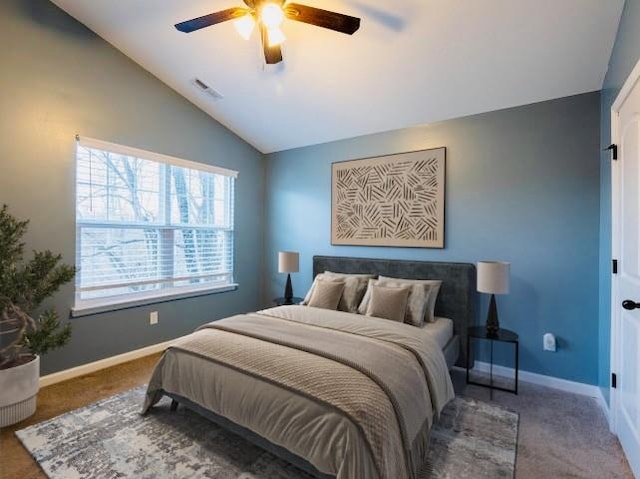 carpeted bedroom featuring vaulted ceiling and ceiling fan