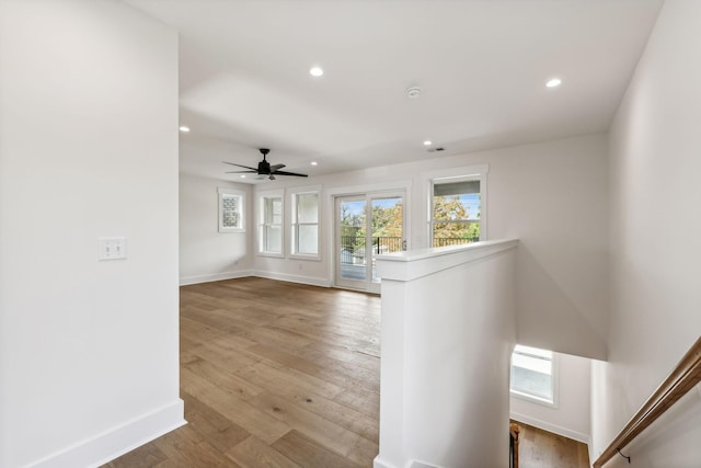 interior space with hardwood / wood-style flooring and ceiling fan