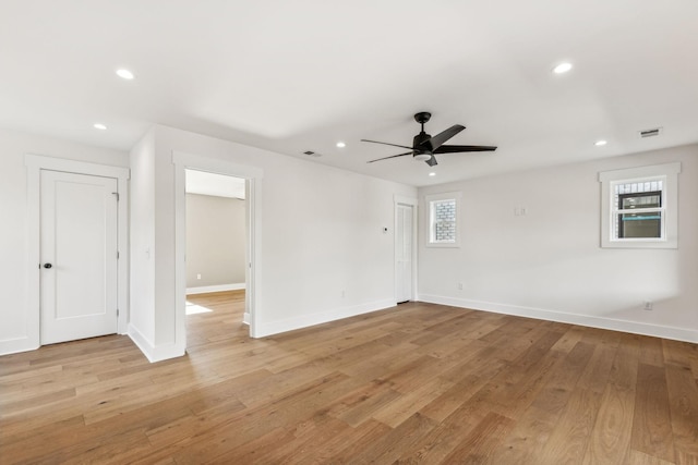 spare room featuring ceiling fan and light wood-type flooring