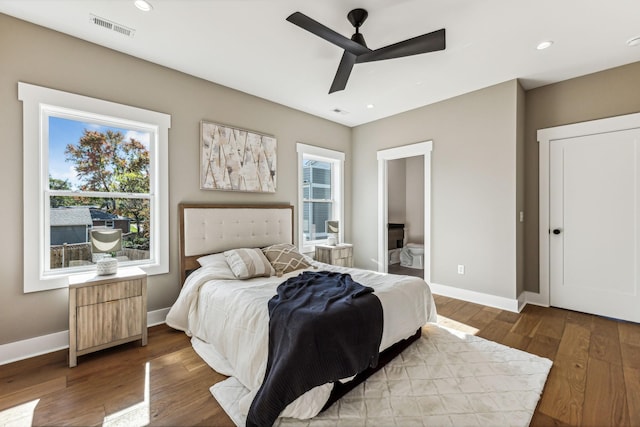 bedroom featuring ceiling fan, connected bathroom, and hardwood / wood-style floors