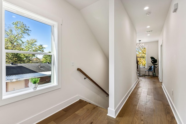 hallway with wood-type flooring