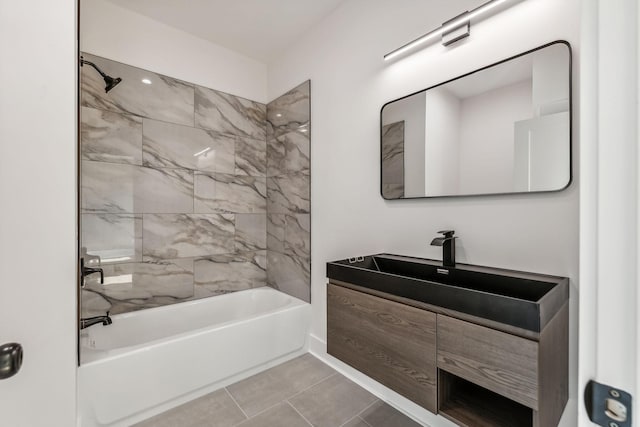 bathroom with tiled shower / bath combo, vanity, and tile patterned floors