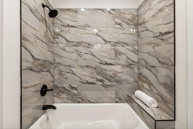 bathroom featuring tiled shower / bath combo