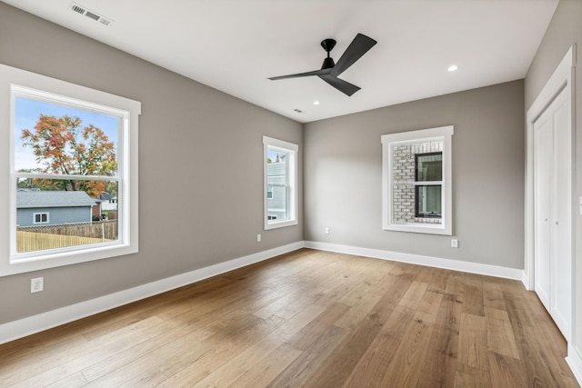 unfurnished bedroom with a closet, ceiling fan, and light hardwood / wood-style flooring