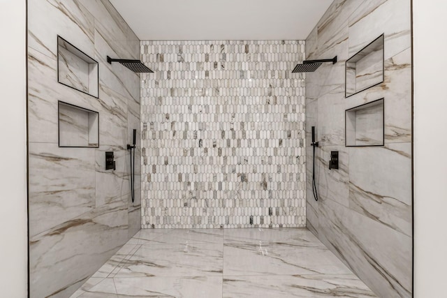 bathroom with tiled shower