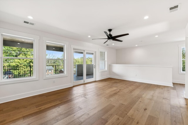 spare room featuring ceiling fan and light hardwood / wood-style floors