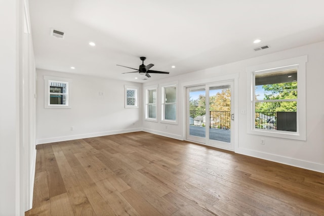 empty room featuring light hardwood / wood-style flooring and ceiling fan