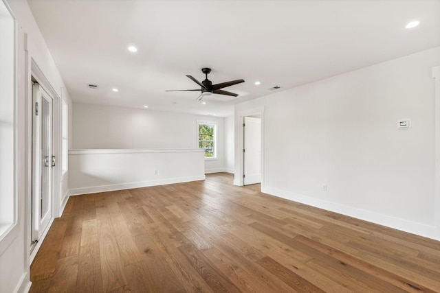 spare room with ceiling fan and hardwood / wood-style floors