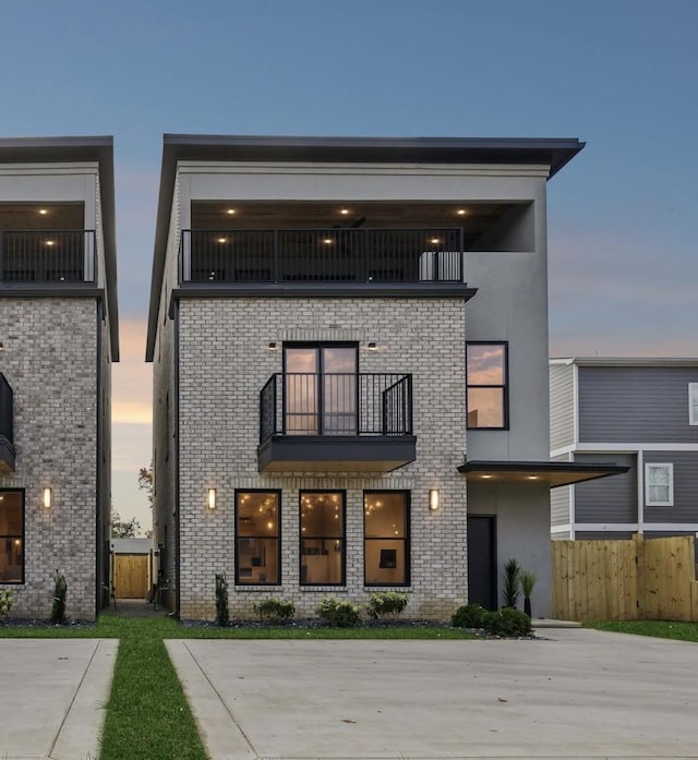 view of front of house with a balcony