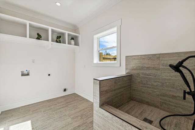 bathroom featuring hardwood / wood-style flooring and crown molding