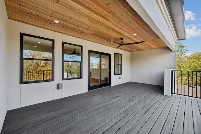 wooden deck featuring ceiling fan