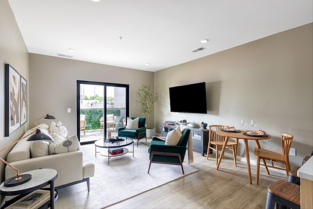 living room with light hardwood / wood-style floors