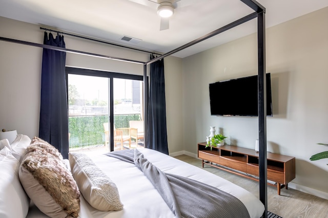 bedroom with hardwood / wood-style flooring, access to exterior, and ceiling fan