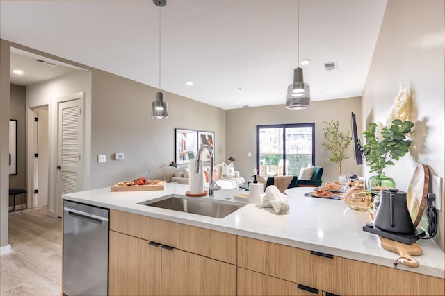 kitchen with sink, hanging light fixtures, light stone countertops, stainless steel dishwasher, and light brown cabinets