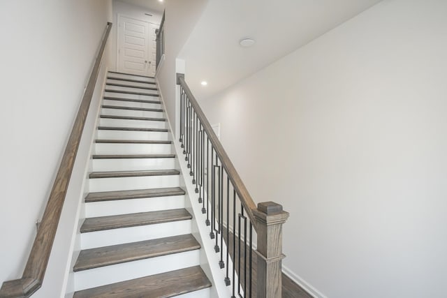 stairway with wood-type flooring