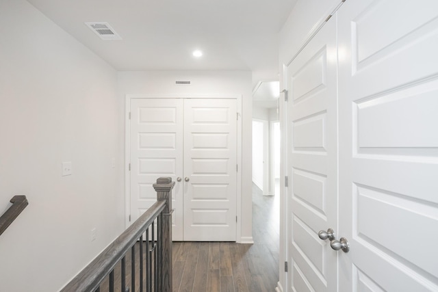 hallway featuring dark hardwood / wood-style floors