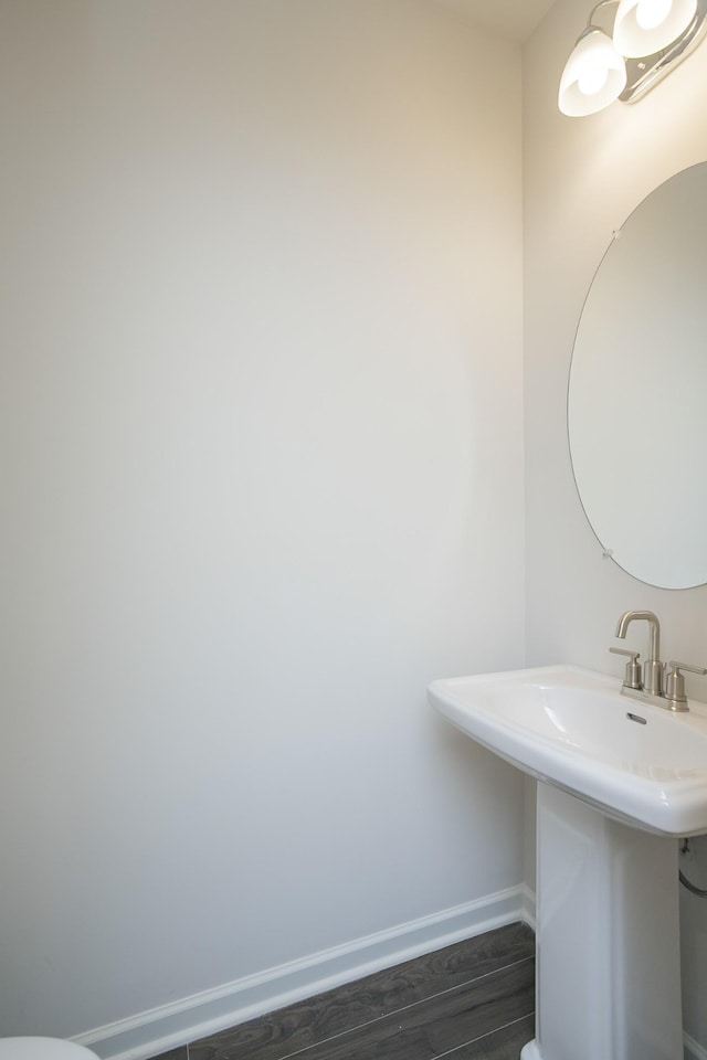 bathroom with sink and hardwood / wood-style flooring