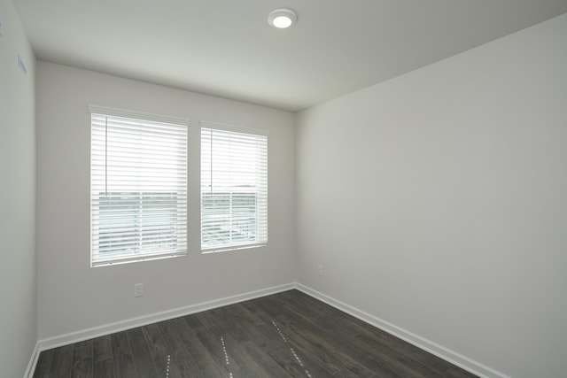 empty room featuring dark wood-type flooring