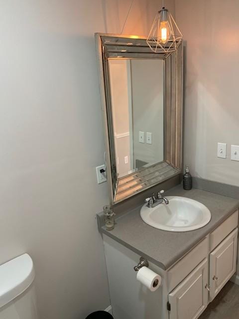 bathroom with vanity and toilet