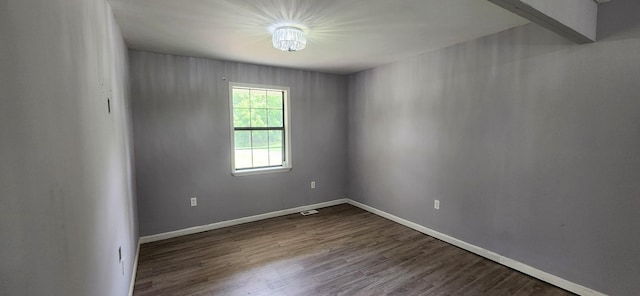 spare room featuring hardwood / wood-style floors