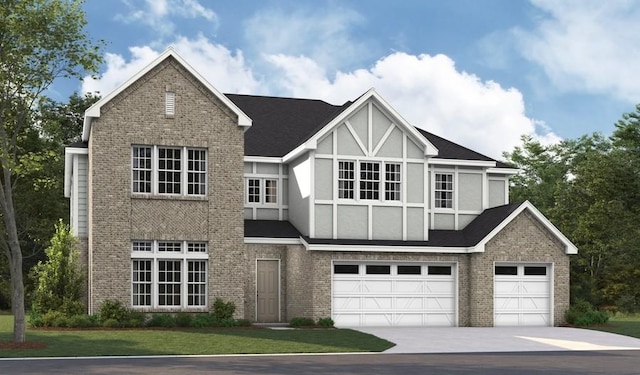 view of front of house with a garage and a front lawn