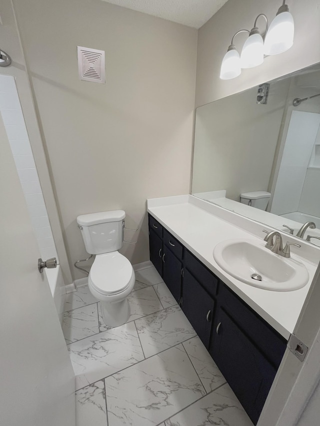 bathroom with vanity, a textured ceiling, toilet, and walk in shower