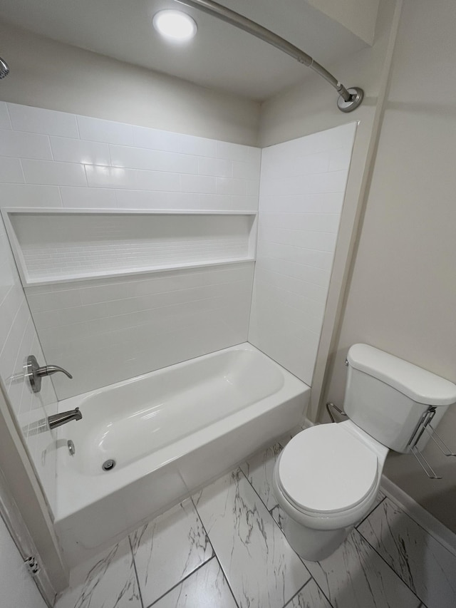 bathroom featuring bathtub / shower combination and toilet