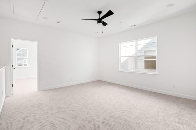 unfurnished room featuring ceiling fan and light colored carpet