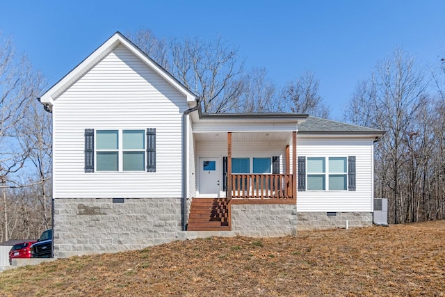 view of front of home featuring covered porch and a front yard