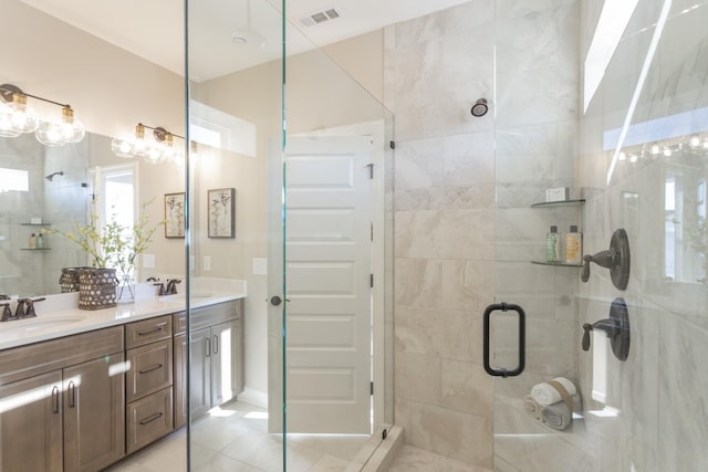 bathroom featuring vanity, tile patterned floors, and walk in shower