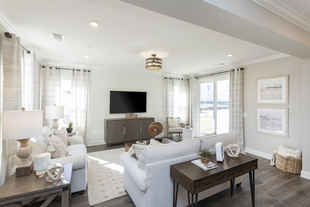 living room featuring crown molding and dark hardwood / wood-style flooring