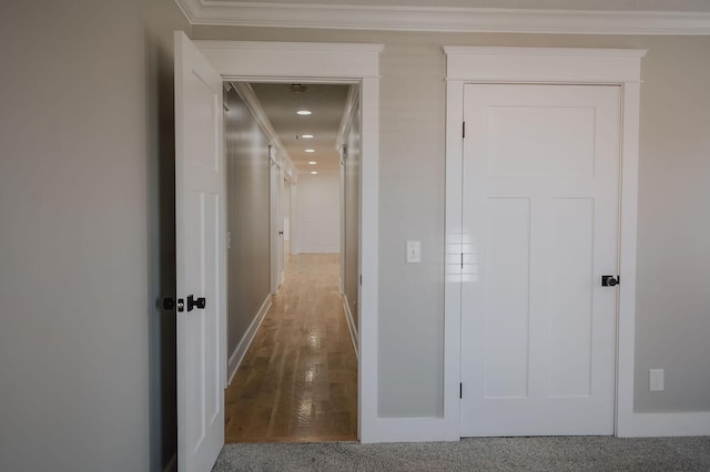 corridor featuring ornamental molding