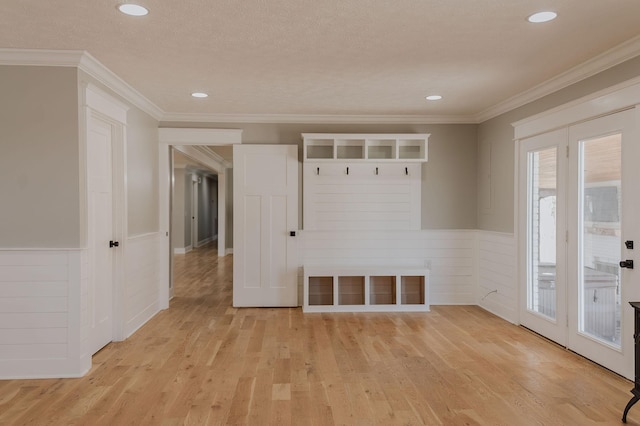 mudroom with ornamental molding, a textured ceiling, and light hardwood / wood-style flooring