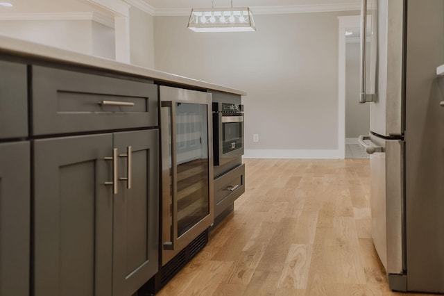 kitchen featuring gray cabinetry, wine cooler, ornamental molding, stainless steel appliances, and light hardwood / wood-style flooring