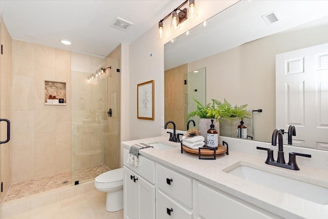 bathroom with walk in shower, vanity, toilet, and tile patterned flooring