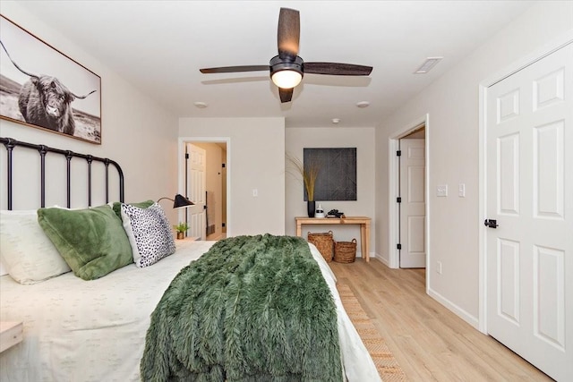 bedroom featuring ceiling fan and light wood-type flooring