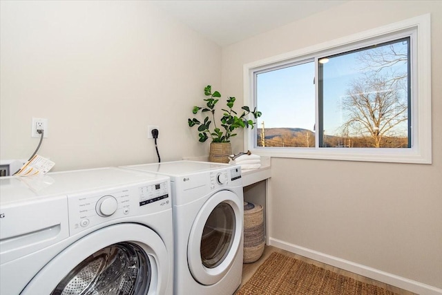 laundry area with separate washer and dryer