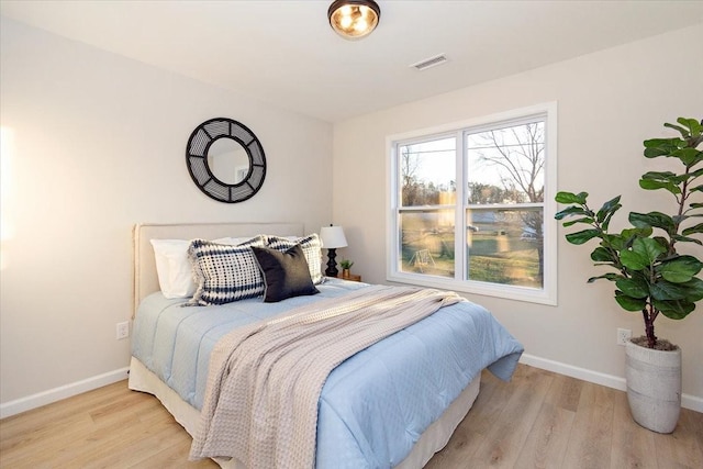 bedroom with light hardwood / wood-style floors