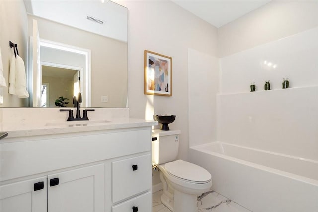 full bathroom with vanity, bathing tub / shower combination, and toilet