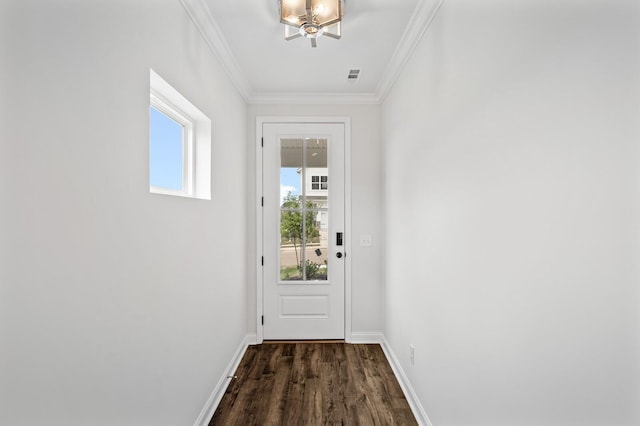 entryway with crown molding, dark hardwood / wood-style floors, and an inviting chandelier