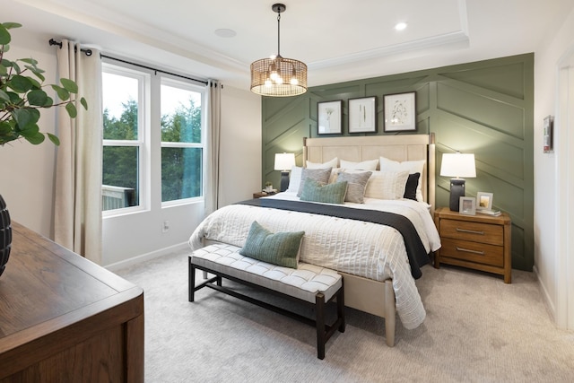 carpeted bedroom with a notable chandelier and crown molding