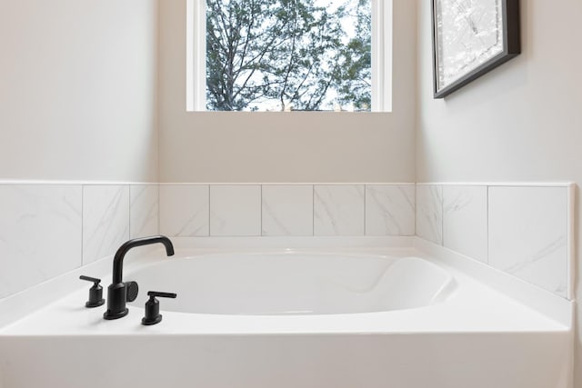 bathroom with a tub