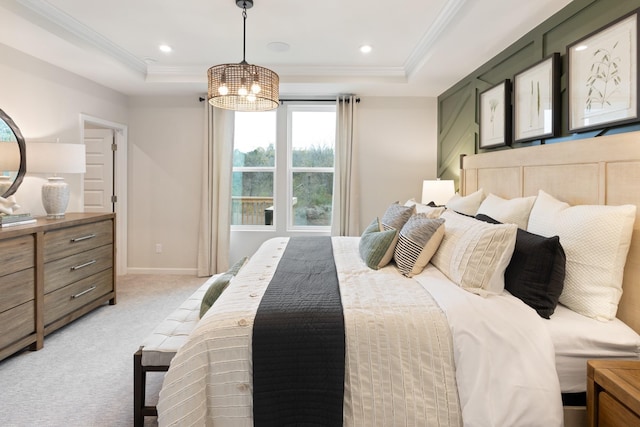 carpeted bedroom with an inviting chandelier, crown molding, and a raised ceiling