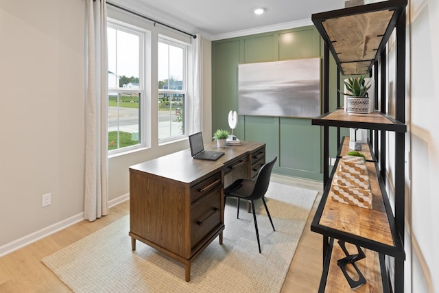 home office featuring ornamental molding and light wood-type flooring