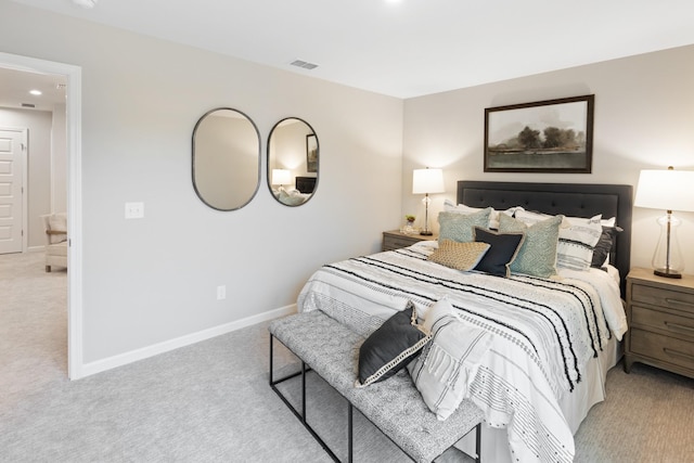 bedroom featuring light colored carpet