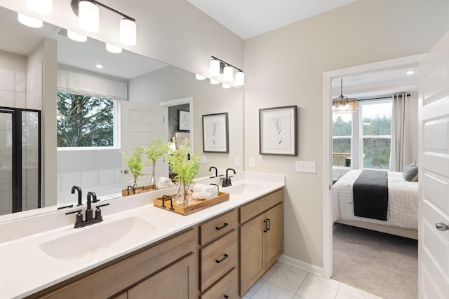 bathroom featuring vanity and an enclosed shower