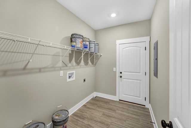 laundry room featuring washer hookup, wood-type flooring, and electric dryer hookup