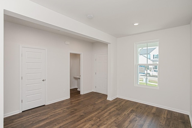 unfurnished room featuring dark hardwood / wood-style floors