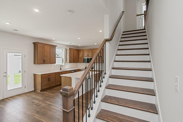 stairway featuring hardwood / wood-style flooring