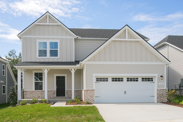 craftsman-style house with a porch, a garage, and a front yard